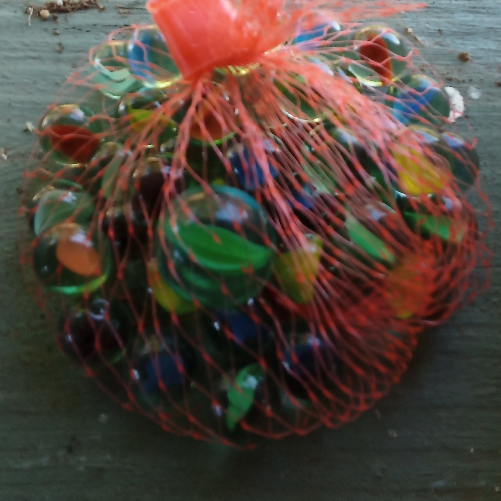 Colorful Glass Marbles in Red Mesh Bag
